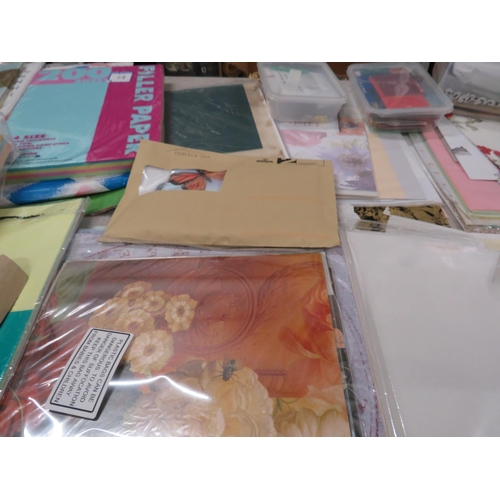 245 - Large selection of crafting paper and card making supplies.