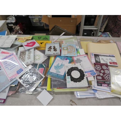 246 - Large selection of crafting paper and card making supplies including cutting dyes.