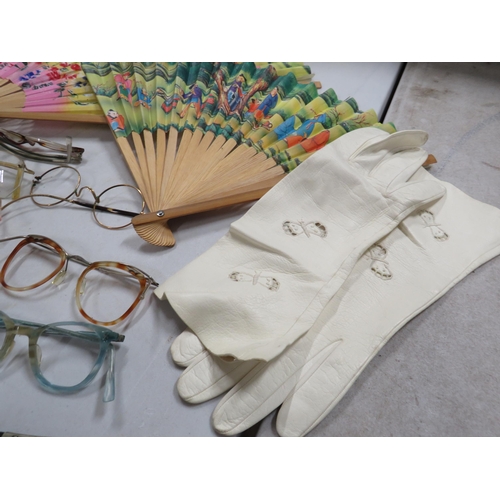 262 - Mixed lot to include vintage fans, glasses frames and bow ties etc.