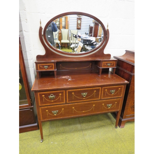 393 - Edwardian Era mirror backed dresser. Raised on tapered legs with original castors.  Inlaid Swags & T... 