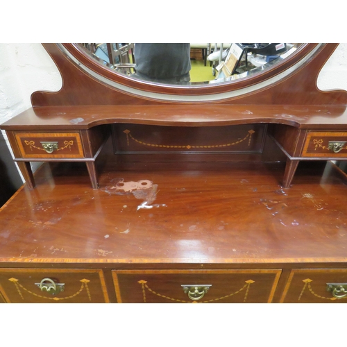 393 - Edwardian Era mirror backed dresser. Raised on tapered legs with original castors.  Inlaid Swags & T... 