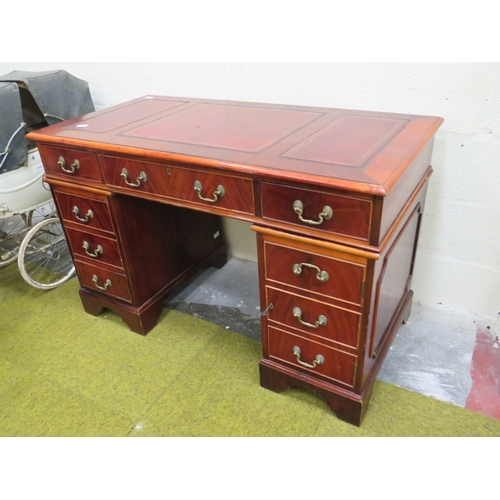 400 - Reproduction Knee Hole twin pedestal desk with three segment writing surface in Red tooled Leather. ... 