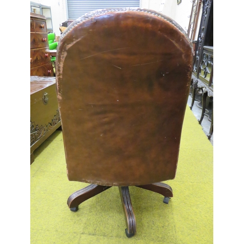 405 - Vintage Leather Chesterfield style office chair with five branch legs on PVC castors. Rise/Recline. ... 