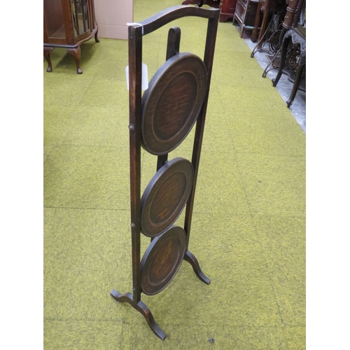 407 - Vintage folding Three tier Oak Cake stand in good order.  Measures approx 34 inches tall.