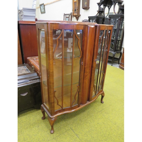 416 - 1930's Era Serpentine fronted Display cabinet with glass shelves inside. Raised on short cabriole le... 