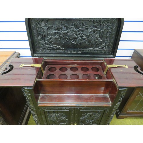 420 - Early 20th Century Oriental Drinks Cabinet. Covered in a plethora of carving to all panels. Side doo... 