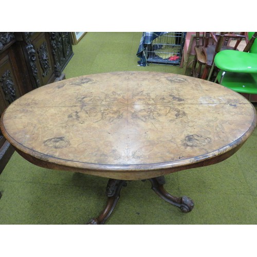 424 - Late Victorian Tilt Top Table with Oval Walnut Veneer top. Heavy Mahogany base with four curved legs... 