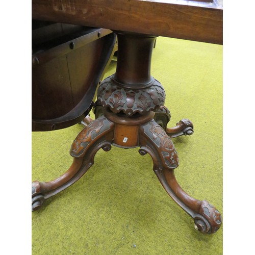 424 - Late Victorian Tilt Top Table with Oval Walnut Veneer top. Heavy Mahogany base with four curved legs... 