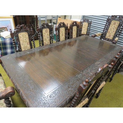 428 - Late 19th Century Dark Oak wind out Dining table with two 18 inch extention leaves. Heavily carved l... 