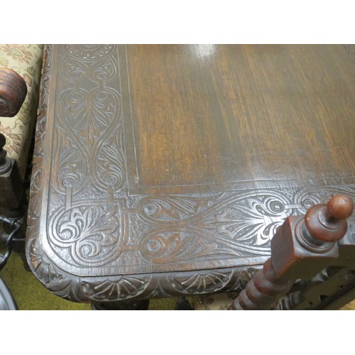 428 - Late 19th Century Dark Oak wind out Dining table with two 18 inch extention leaves. Heavily carved l... 