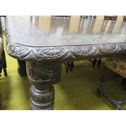 428 - Late 19th Century Dark Oak wind out Dining table with two 18 inch extention leaves. Heavily carved l... 