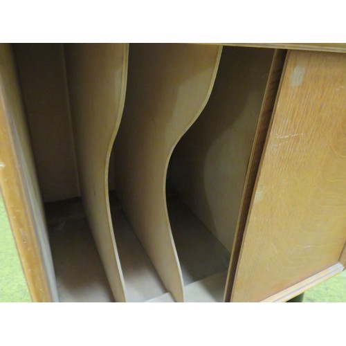 430 - Pleasing small Teak effect Record cabinet. Raised on screw in , ebonised tapered cylindrical legs, s... 