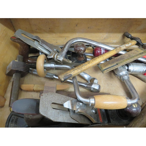 323 - Wooden tool chest and contents including Planes, spanners, hammers, hand drills etc.