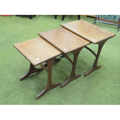 433 - Mid to Late 20th Century, Scandinavian Style Teak nest of three stacking tables with curved back str... 