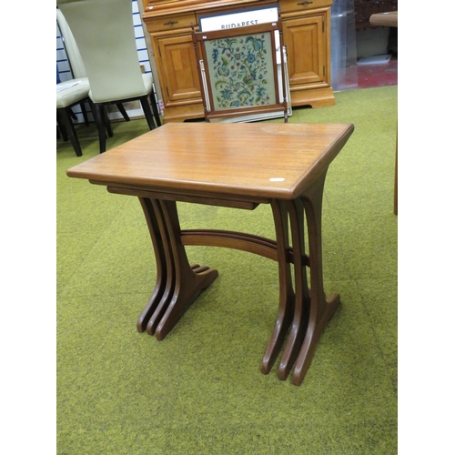 433 - Mid to Late 20th Century, Scandinavian Style Teak nest of three stacking tables with curved back str... 