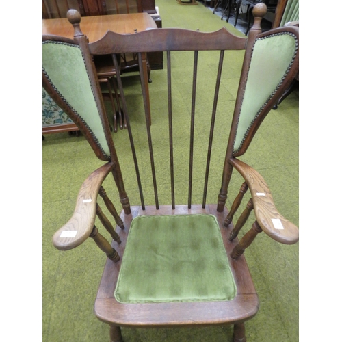 436 - Oak Armchair with turned legs and arm supports. Detachable cushions, Fixed wings. Height to seat 17 ... 