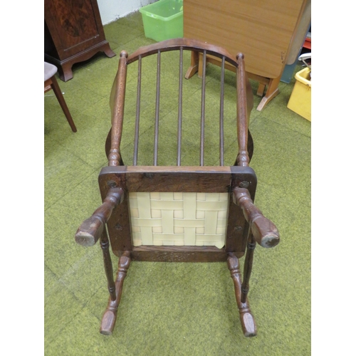 436 - Oak Armchair with turned legs and arm supports. Detachable cushions, Fixed wings. Height to seat 17 ... 