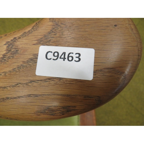 436 - Oak Armchair with turned legs and arm supports. Detachable cushions, Fixed wings. Height to seat 17 ... 