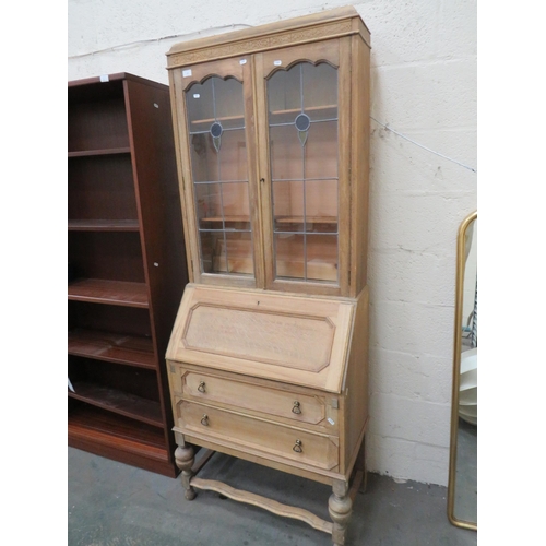 439 - Pale Oak Secrataire/Bookcase. Drop down writing surface, Leaded glass to Bookcase. Measures H:77 x W... 