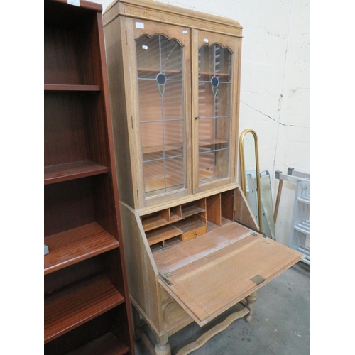 439 - Pale Oak Secrataire/Bookcase. Drop down writing surface, Leaded glass to Bookcase. Measures H:77 x W... 