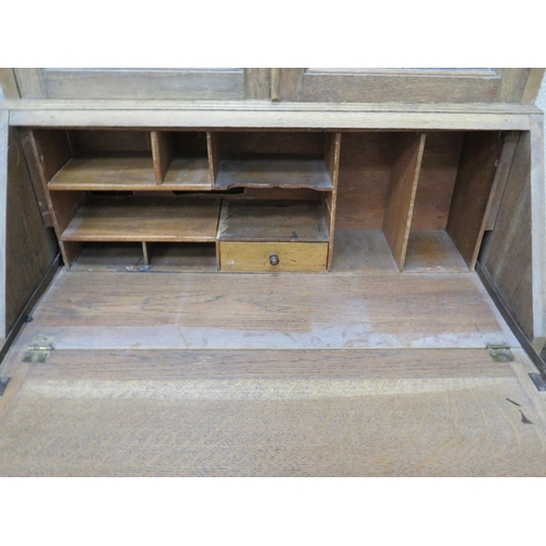 439 - Pale Oak Secrataire/Bookcase. Drop down writing surface, Leaded glass to Bookcase. Measures H:77 x W... 