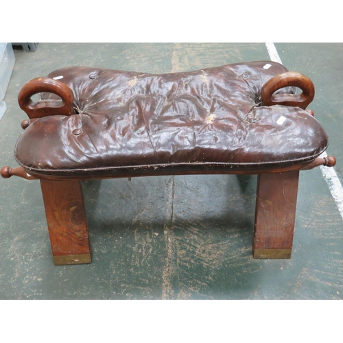 441 - Two Middle Eastern Camel seats. Wooden frames with Leather Saddles. Each measures approx H:14 x W:23... 