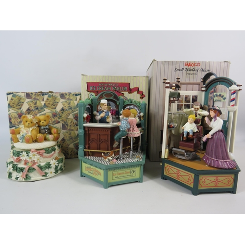 139 - Two Enesco Small World of Music shops and a Cherised teddies musical figurine, all with boxes.