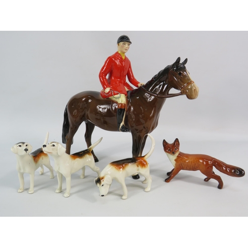163 - Beswick Huntsman on a bay horse plus three hounds and a fox (one hound has a repair to tail).