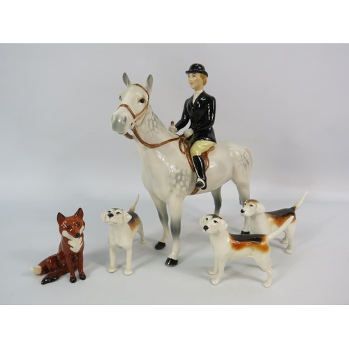 171 - Beswick Huntswomen on Dapple Grey horse plus three hounds and a fox.
