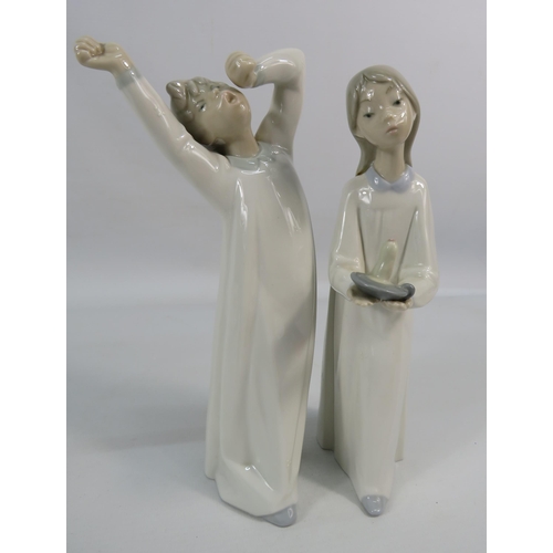 190 - Two Lladro figuines, Girl with candle and Boy yawning, approx 9