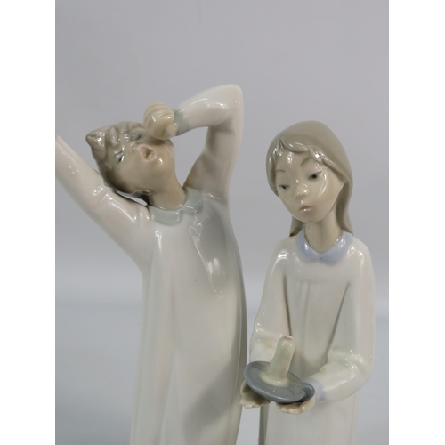 190 - Two Lladro figuines, Girl with candle and Boy yawning, approx 9