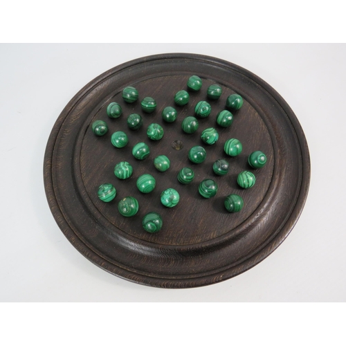 237 - Antique dark oak solitare board with a full set of malachite marbles.