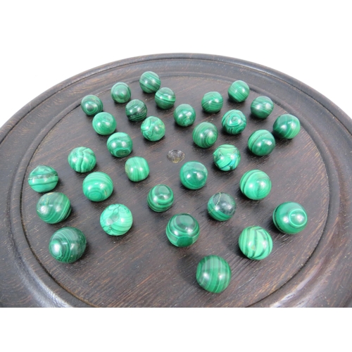 237 - Antique dark oak solitare board with a full set of malachite marbles.