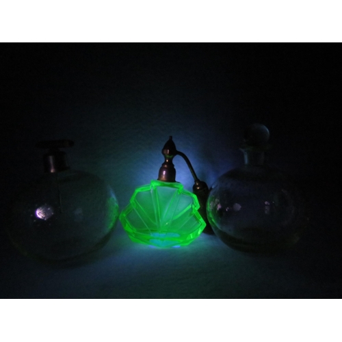 238 - Three vintage Uranium glass scent bottles.