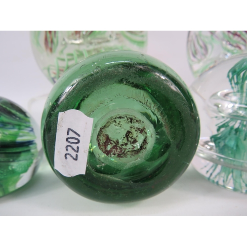 245 - Six art glass paperweights including one Victorian dump glass.