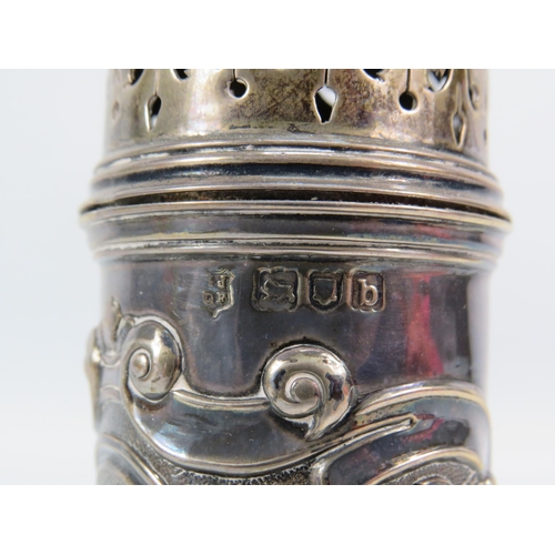 254 - London 1897 Sterling silver sugar sifter with embossed decoration and a blank cartouche, 4.5