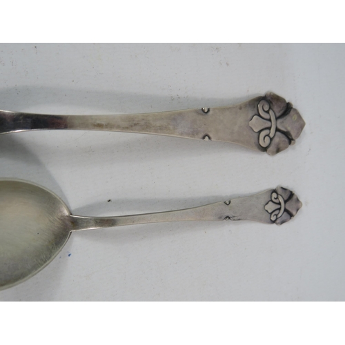 255 - Two Danish sterling silver spoons by Christian F Heise. C1923, 51.9grams.