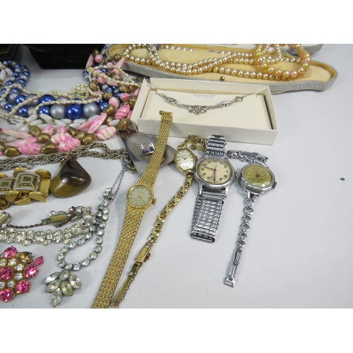 298 - Mixed lot of costume jewellery, watches, brooches, earrings etc.