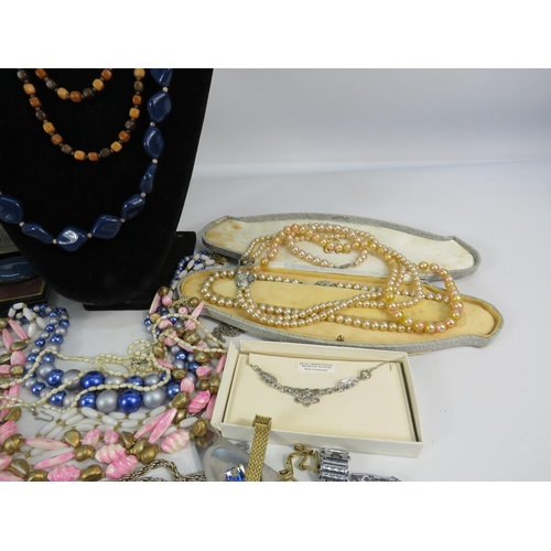 298 - Mixed lot of costume jewellery, watches, brooches, earrings etc.