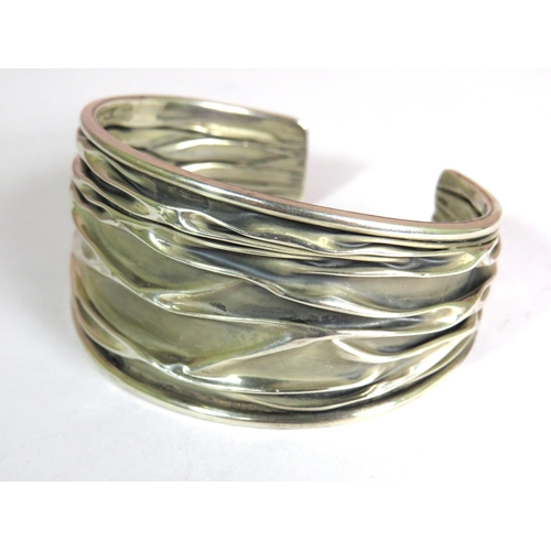 322 - 925 Sterling Silver Cuff Bangle with textured finish. Approx 30g in weight.