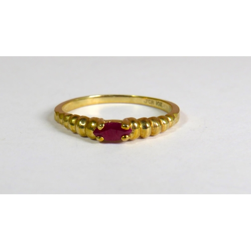 334 - 9ct Yellow Gold Ring set with an Oval Ruby which measures approx 5 x 3mm.  Fingers size R-5 1.9g