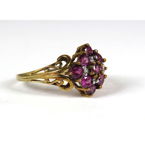 337 - 9ct Yellow Gold ring with fancy Scrolled Shoulders set with 9 Amethysts and four tiny Diamonds to ce... 