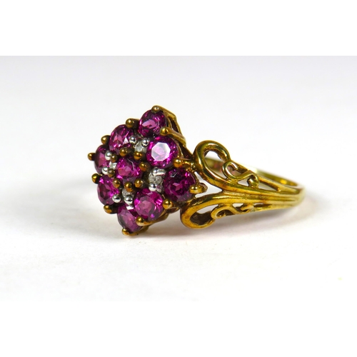 337 - 9ct Yellow Gold ring with fancy Scrolled Shoulders set with 9 Amethysts and four tiny Diamonds to ce... 