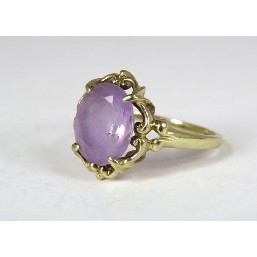 358 - 9ct Yellow Gold ring set with a large Oval Amethyst which measures approx 12 x 10 mm. Finger size 'T... 