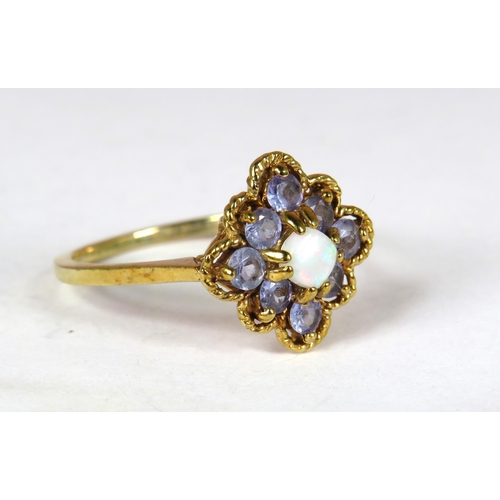 359 - 9ct Yellow Gold ring set with Eight circular Topaz Gemstones with a small white Opal to centre in a ... 