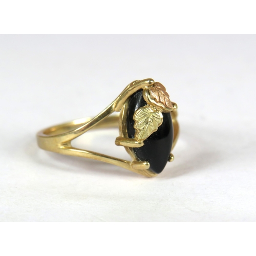 363 - 9ct Yellow Gold Black Hills Onyx Set ring with Leaf mount. Finger size 'O'   2.3g