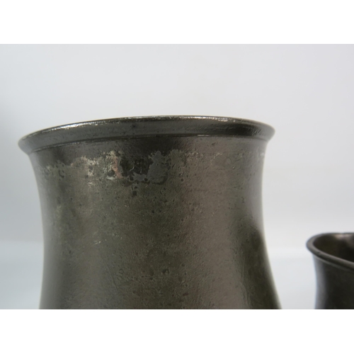 409 - Two Tulip shaped 19th century English pewter tankards a pint and a gill.