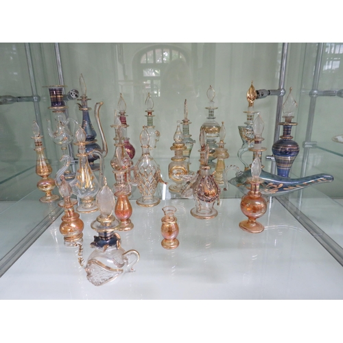 438 - 22 Egyptian glass scent bottles.