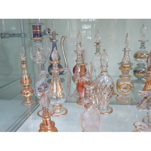 438 - 22 Egyptian glass scent bottles.