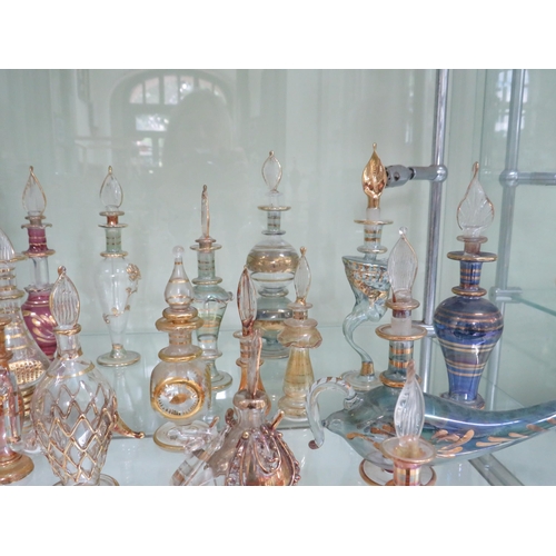 438 - 22 Egyptian glass scent bottles.